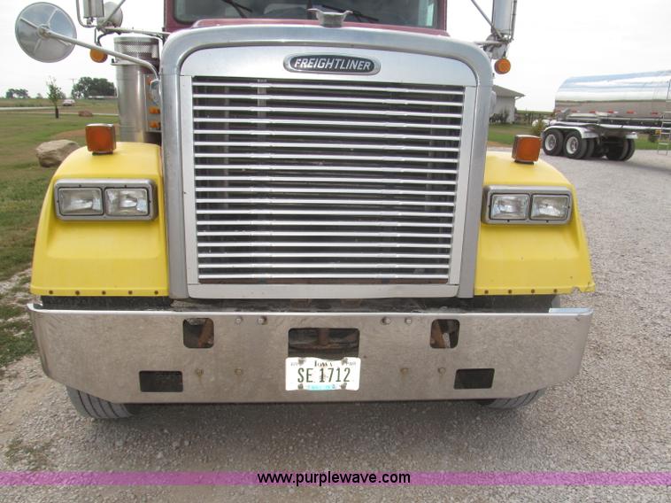 image for item F7111 2000 Freightliner FLD120SD tri axle dump truck