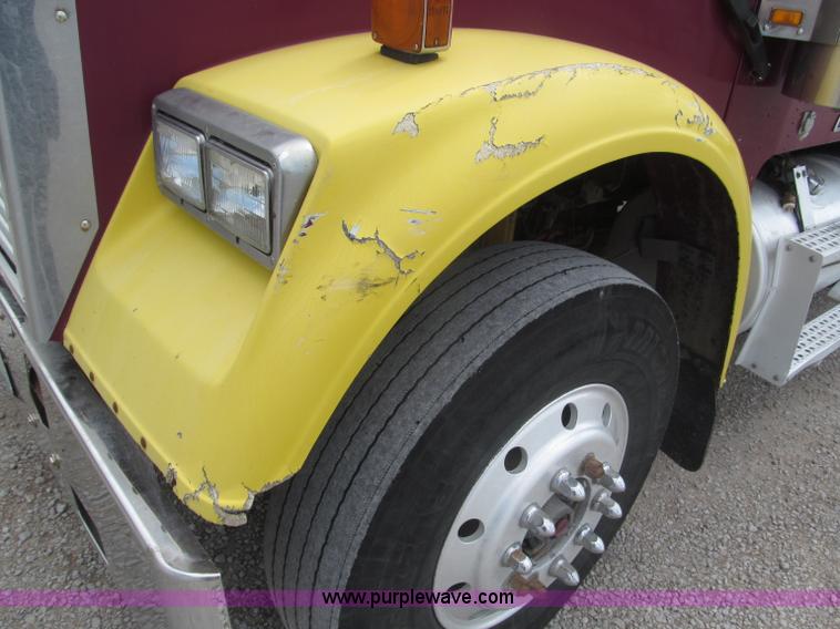 image for item F7111 2000 Freightliner FLD120SD tri axle dump truck