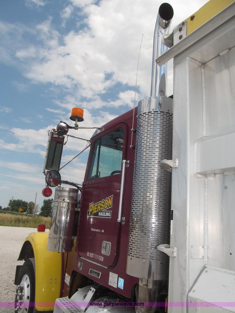 image for item F7111 2000 Freightliner FLD120SD tri axle dump truck