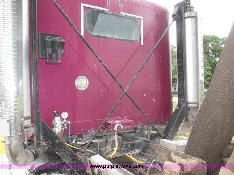 image for item F7111 2000 Freightliner FLD120SD tri axle dump truck