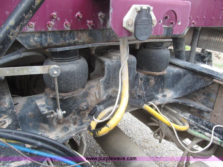 image for item F7111 2000 Freightliner FLD120SD tri axle dump truck