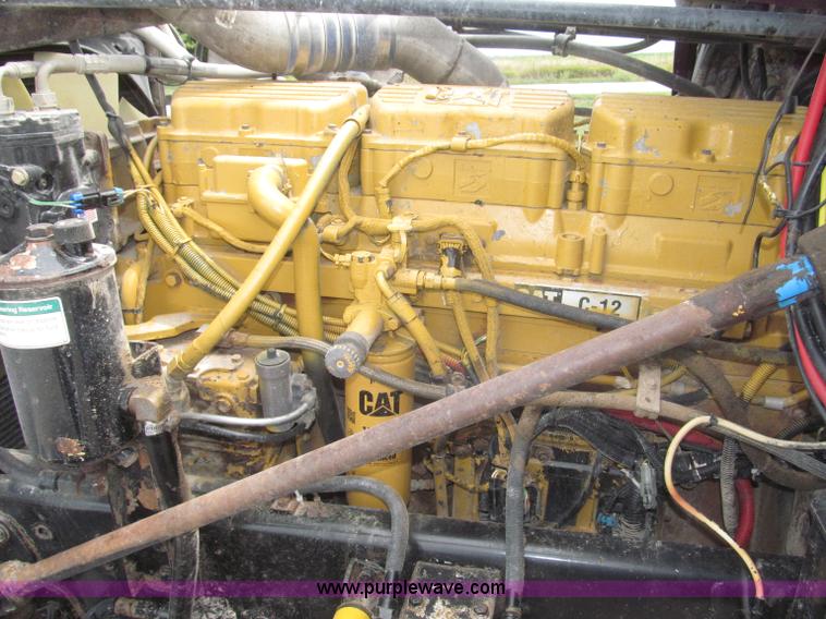 image for item F7111 2000 Freightliner FLD120SD tri axle dump truck