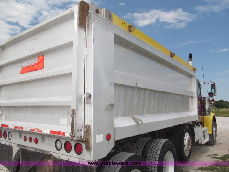 image for item F7111 2000 Freightliner FLD120SD tri axle dump truck