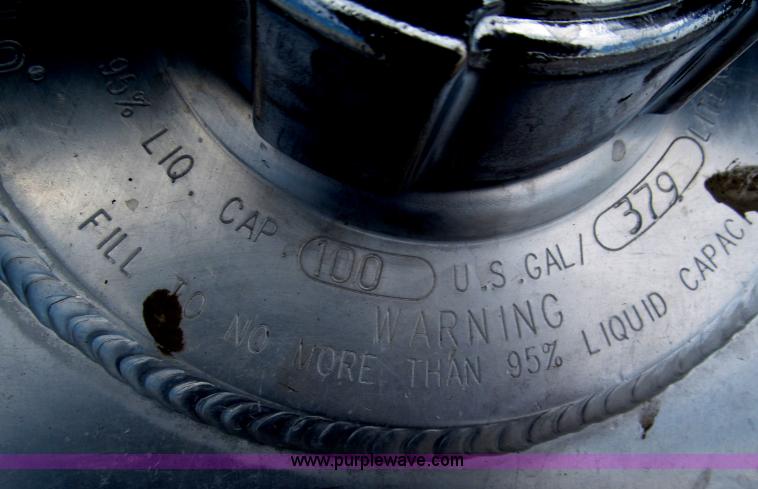 image for item F7111 2000 Freightliner FLD120SD tri axle dump truck