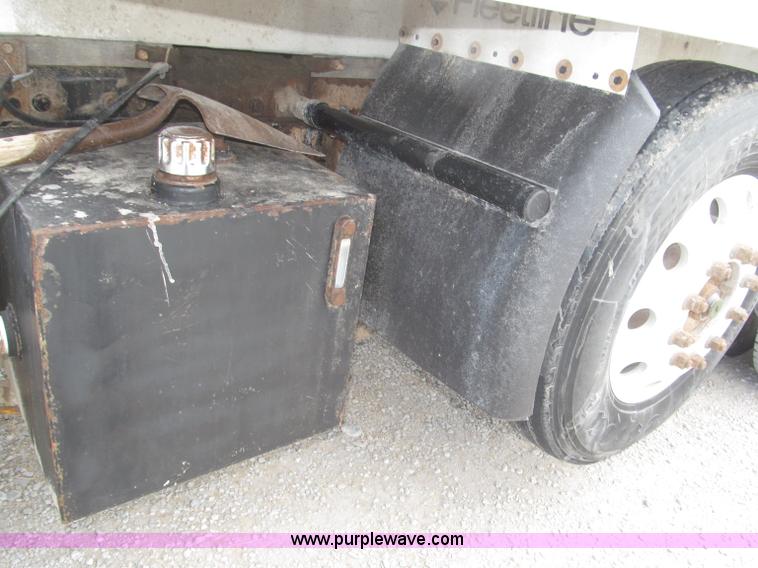 image for item F7111 2000 Freightliner FLD120SD tri axle dump truck