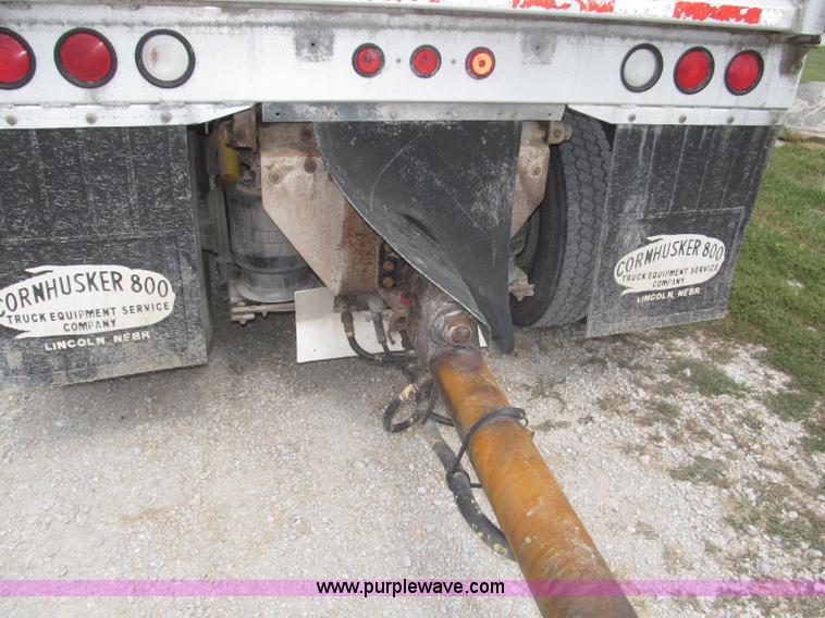 image for item F7111 2000 Freightliner FLD120SD tri axle dump truck