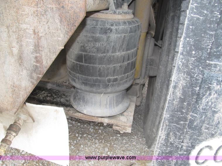 image for item F7111 2000 Freightliner FLD120SD tri axle dump truck