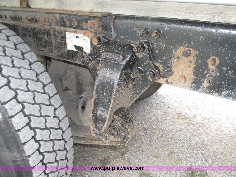 image for item F7111 2000 Freightliner FLD120SD tri axle dump truck