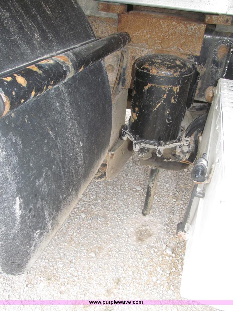 image for item F7111 2000 Freightliner FLD120SD tri axle dump truck