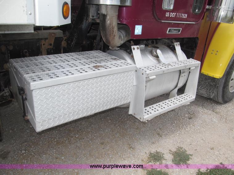 image for item F7111 2000 Freightliner FLD120SD tri axle dump truck