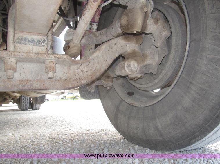 image for item F7111 2000 Freightliner FLD120SD tri axle dump truck