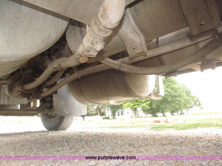 image for item F7111 2000 Freightliner FLD120SD tri axle dump truck