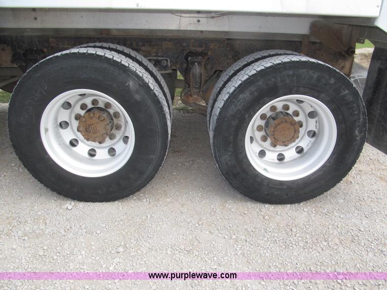 image for item F7111 2000 Freightliner FLD120SD tri axle dump truck