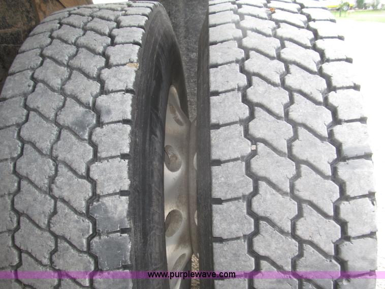 image for item F7111 2000 Freightliner FLD120SD tri axle dump truck