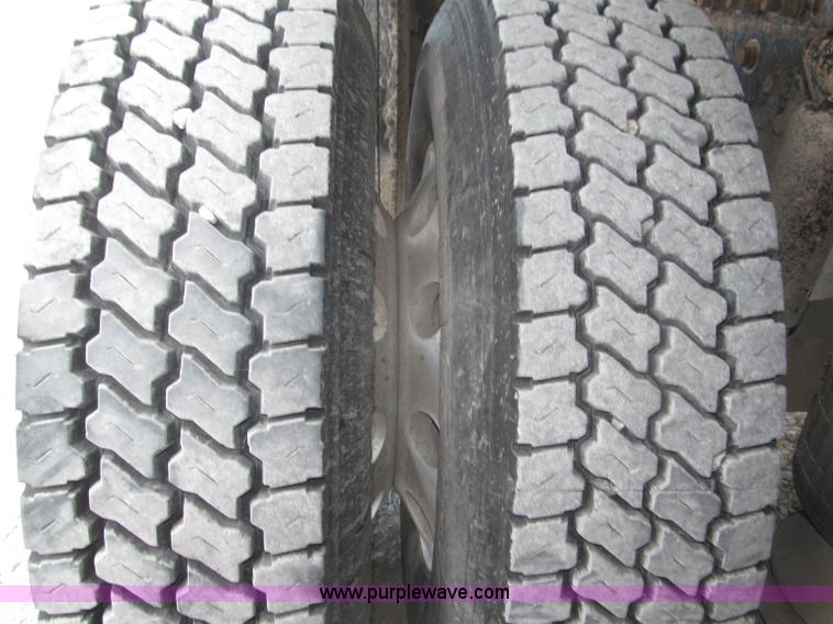 image for item F7111 2000 Freightliner FLD120SD tri axle dump truck