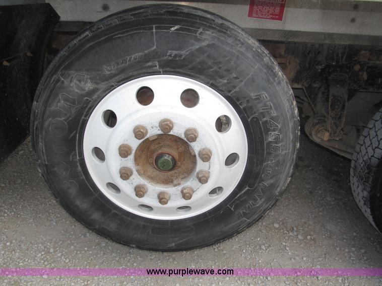 image for item F7111 2000 Freightliner FLD120SD tri axle dump truck