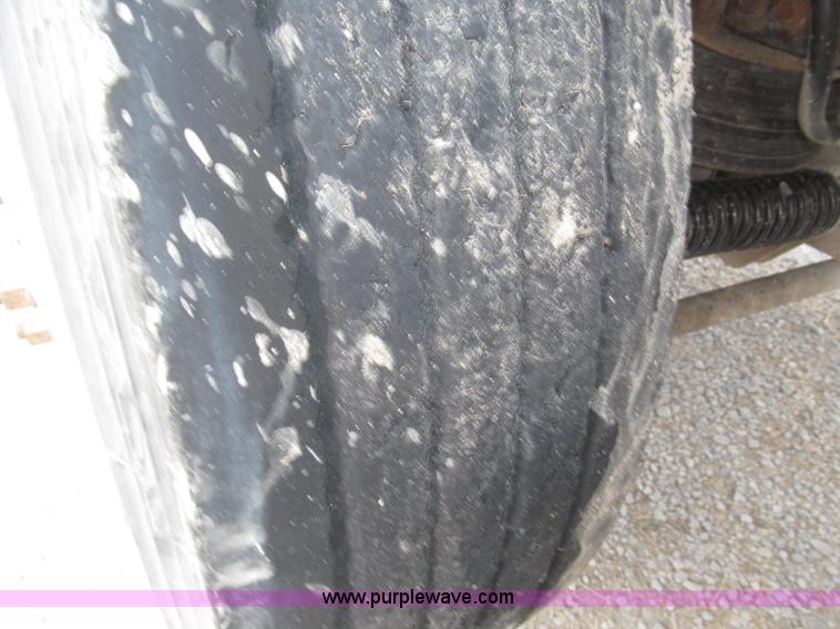 image for item F7111 2000 Freightliner FLD120SD tri axle dump truck