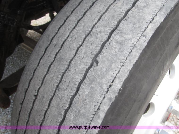 image for item F7111 2000 Freightliner FLD120SD tri axle dump truck