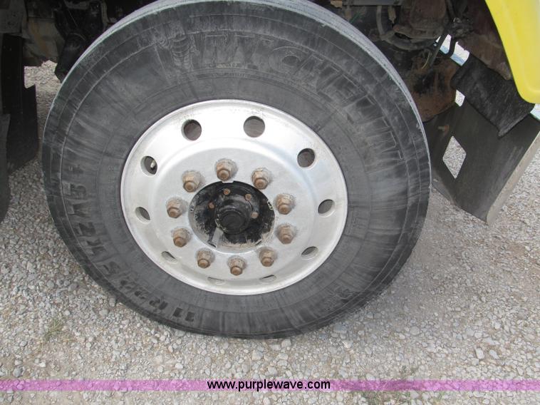 image for item F7111 2000 Freightliner FLD120SD tri axle dump truck