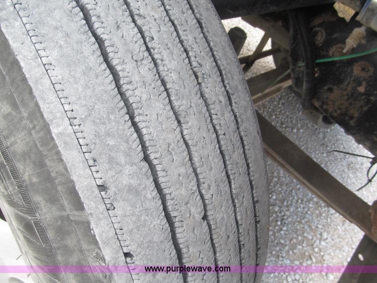 image for item F7111 2000 Freightliner FLD120SD tri axle dump truck