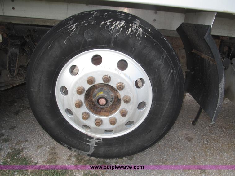 image for item F7111 2000 Freightliner FLD120SD tri axle dump truck