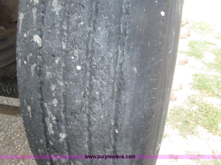 image for item F7111 2000 Freightliner FLD120SD tri axle dump truck