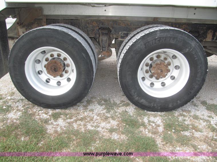 image for item F7111 2000 Freightliner FLD120SD tri axle dump truck