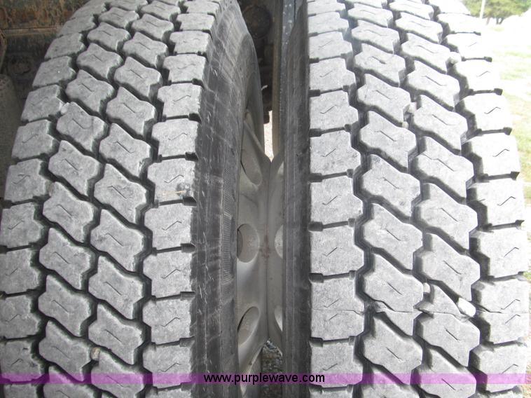 image for item F7111 2000 Freightliner FLD120SD tri axle dump truck