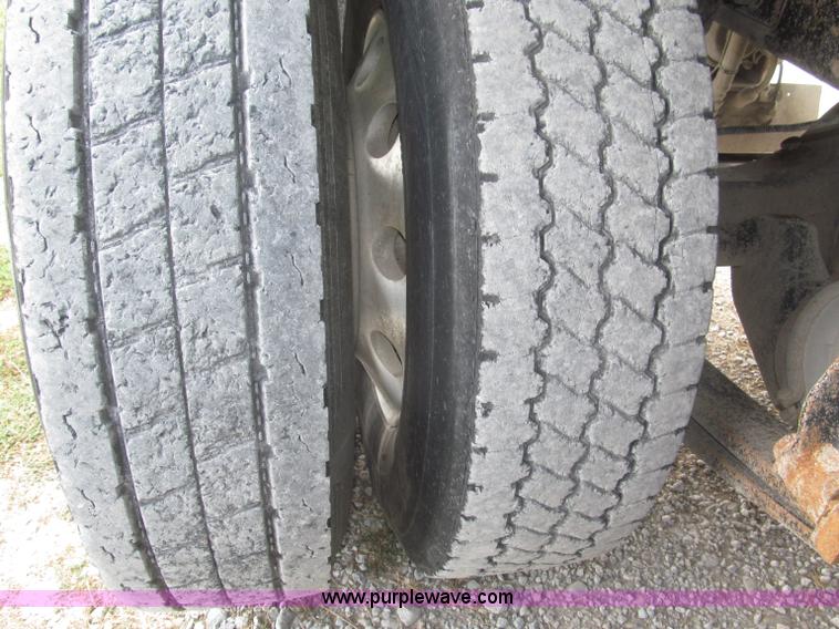 image for item F7111 2000 Freightliner FLD120SD tri axle dump truck