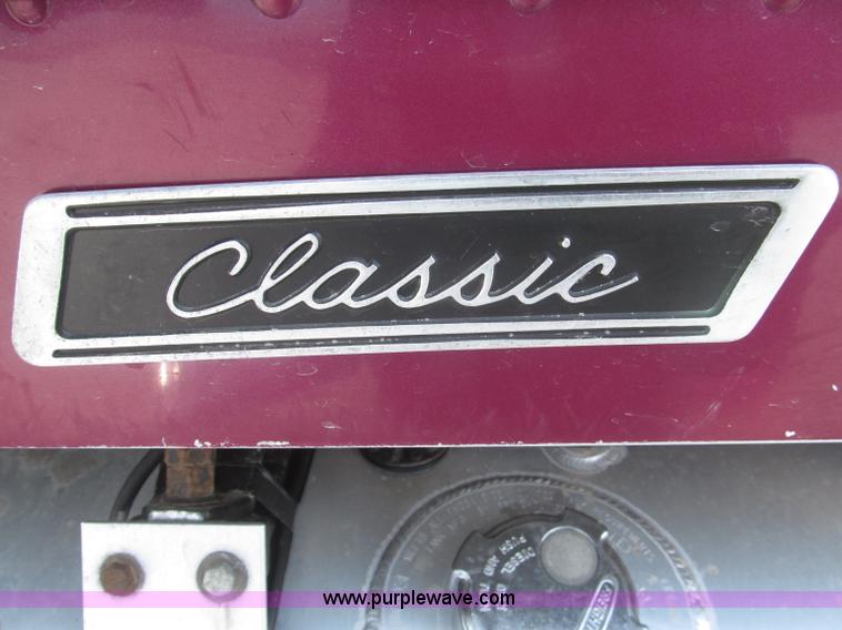 image for item F7111 2000 Freightliner FLD120SD tri axle dump truck