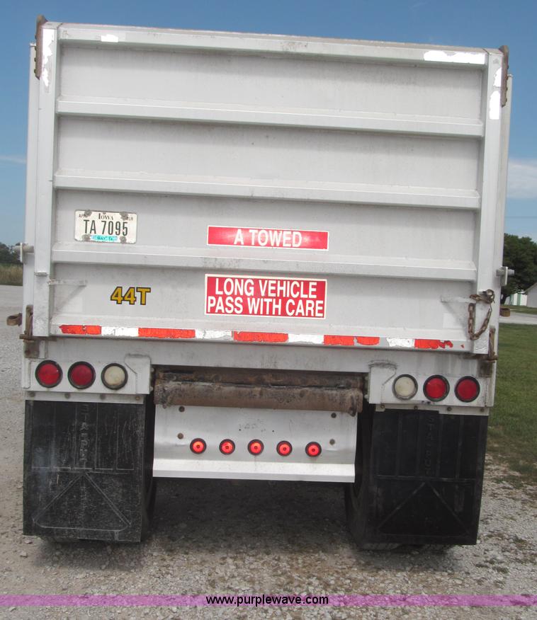 image for item F7112 1999 Cornhusker triple axle 14' pup dump trailer