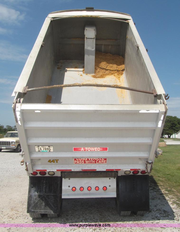 image for item F7112 1999 Cornhusker triple axle 14' pup dump trailer