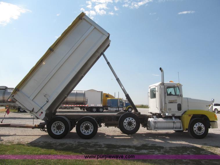 image for item F7115 2001 Freightliner FLD120 tri axle dump truck