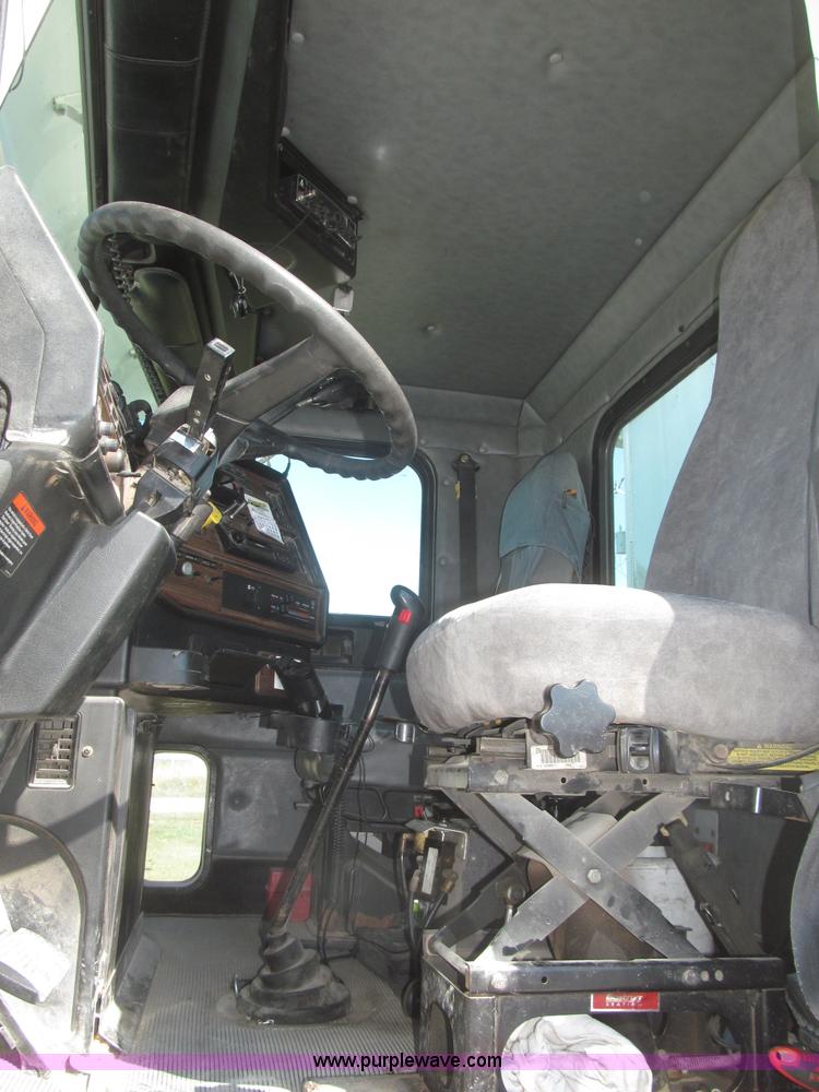 image for item F7115 2001 Freightliner FLD120 tri axle dump truck