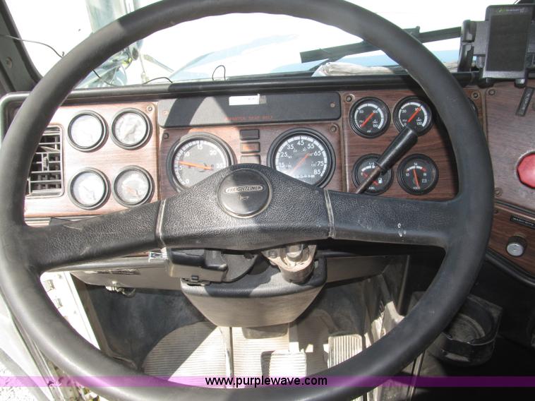 image for item F7115 2001 Freightliner FLD120 tri axle dump truck