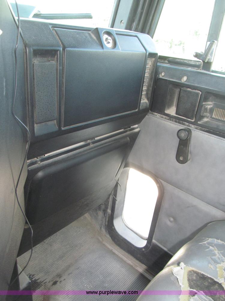 image for item F7115 2001 Freightliner FLD120 tri axle dump truck