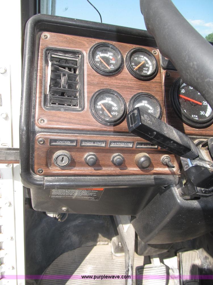 image for item F7115 2001 Freightliner FLD120 tri axle dump truck