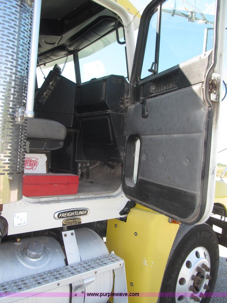 image for item F7115 2001 Freightliner FLD120 tri axle dump truck