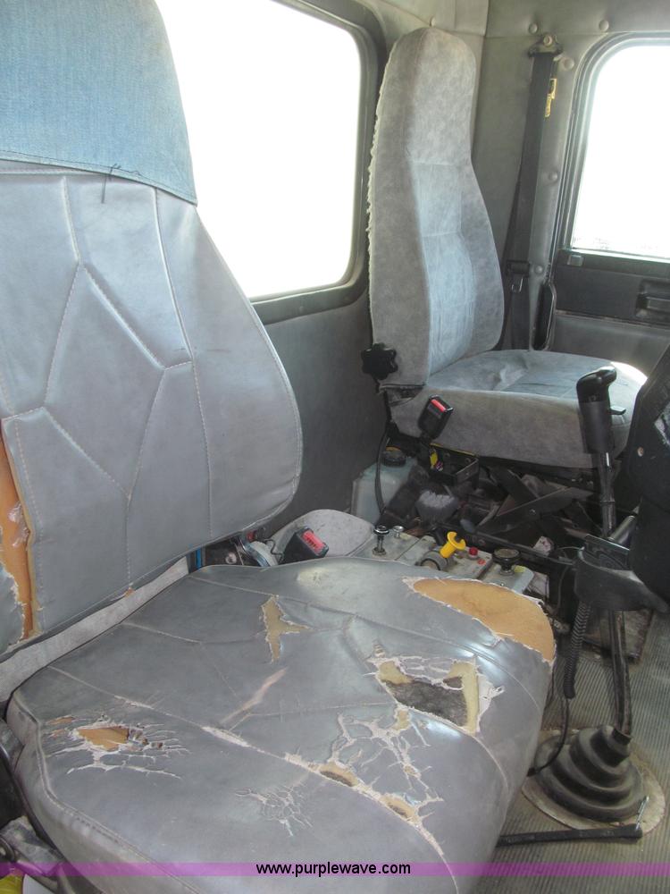 image for item F7115 2001 Freightliner FLD120 tri axle dump truck