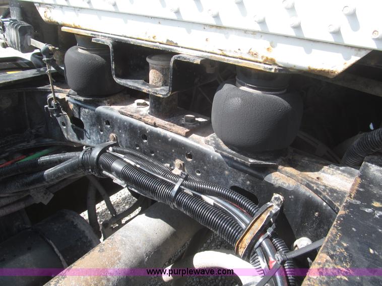 image for item F7115 2001 Freightliner FLD120 tri axle dump truck