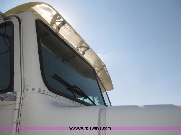 image for item F7115 2001 Freightliner FLD120 tri axle dump truck