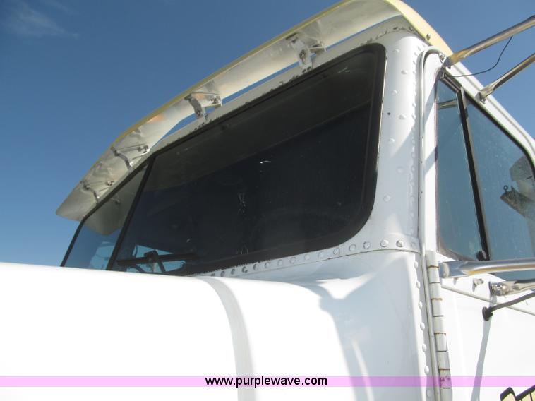 image for item F7115 2001 Freightliner FLD120 tri axle dump truck