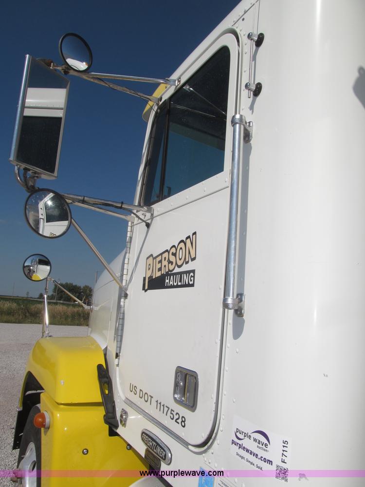 image for item F7115 2001 Freightliner FLD120 tri axle dump truck