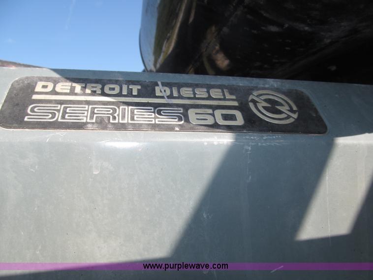 image for item F7115 2001 Freightliner FLD120 tri axle dump truck