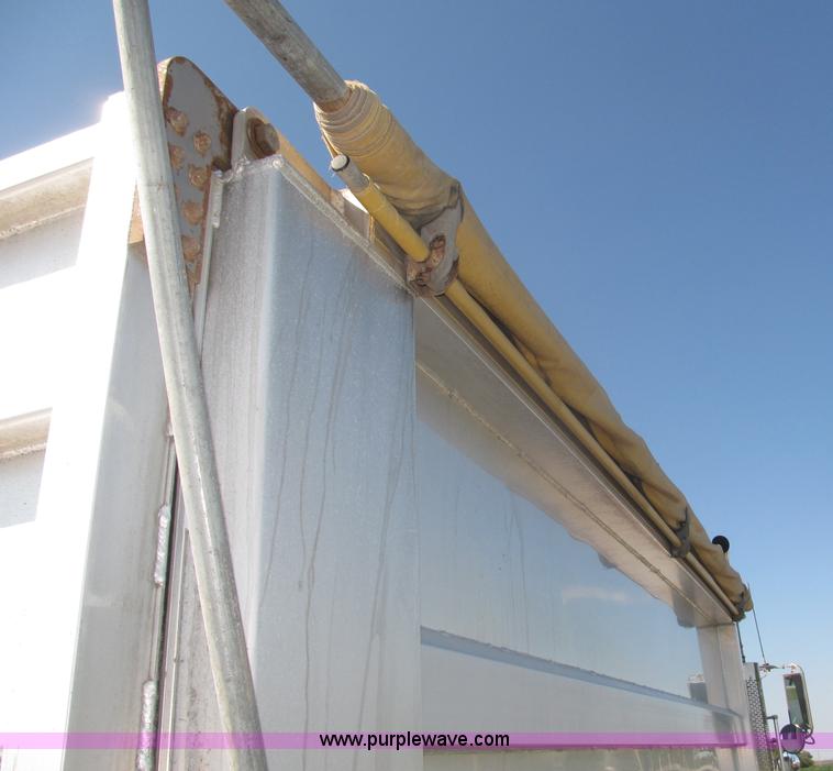 image for item F7115 2001 Freightliner FLD120 tri axle dump truck