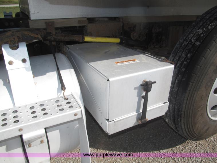 image for item F7115 2001 Freightliner FLD120 tri axle dump truck