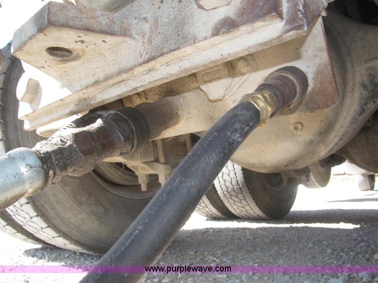 image for item F7115 2001 Freightliner FLD120 tri axle dump truck