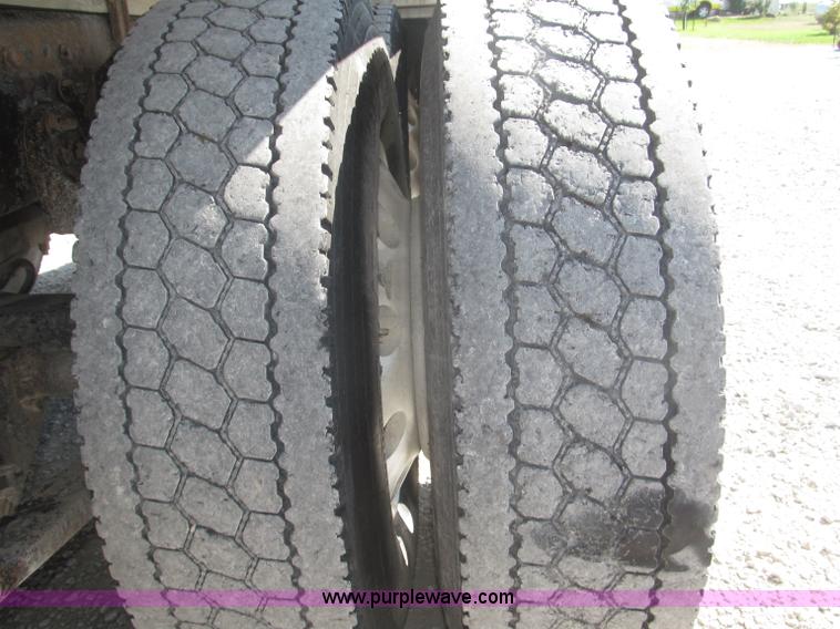 image for item F7115 2001 Freightliner FLD120 tri axle dump truck