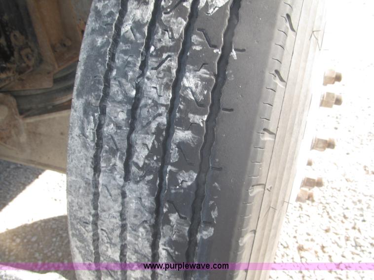 image for item F7115 2001 Freightliner FLD120 tri axle dump truck