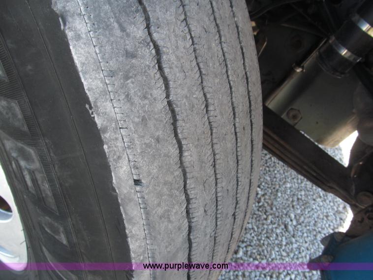 image for item F7115 2001 Freightliner FLD120 tri axle dump truck